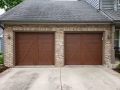 Two matching wooden garage doors on a two door garage.