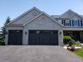 A slate grey canyon ultra grain collection garage door